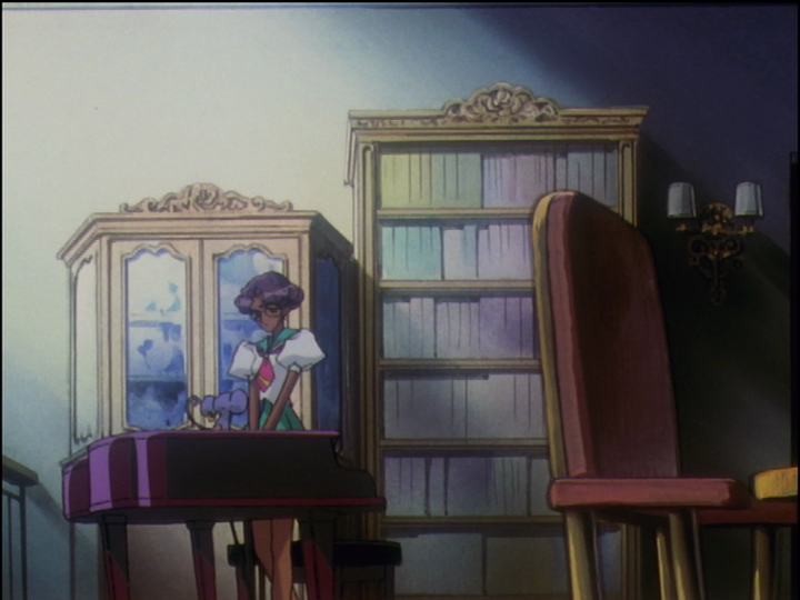 The bookcase and piano in the dorm lounge.