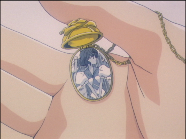 Juri’s locket, open to show the picture of Shiori.