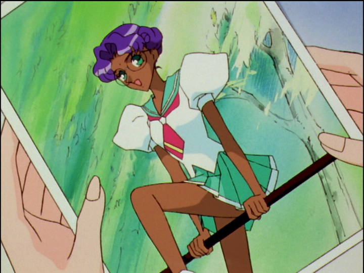 Anthy—but actually Utena—is on top of a horizontal bar.