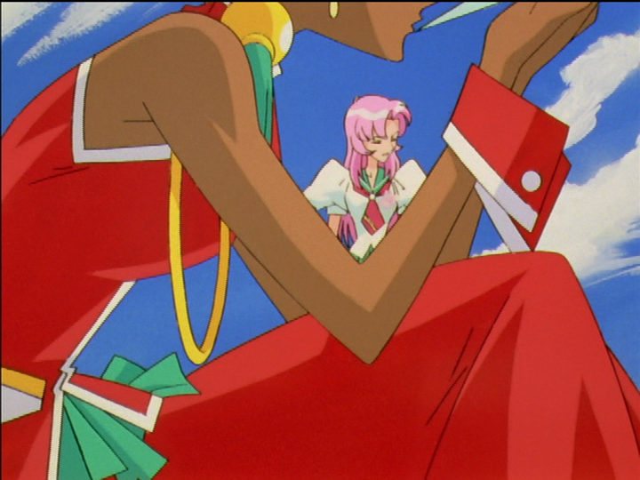 Anthy kisses the sharp tip of the Sword of Dios, while Utena in the background looks away in empathetic pain.