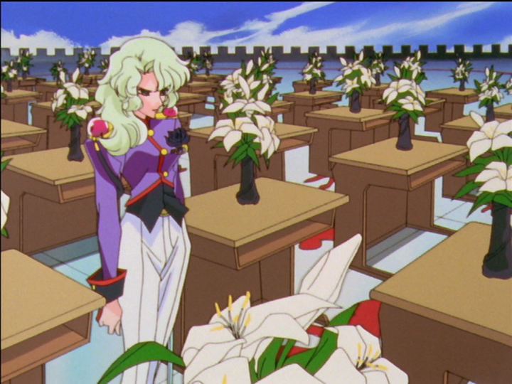 Kanae in the dueling arena, with white lilies on the desks.