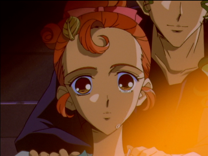 Reflection of Wakaba and Saionji in Wakaba’s oval mirror, the carved leaf in her hair and tears on her cheek.