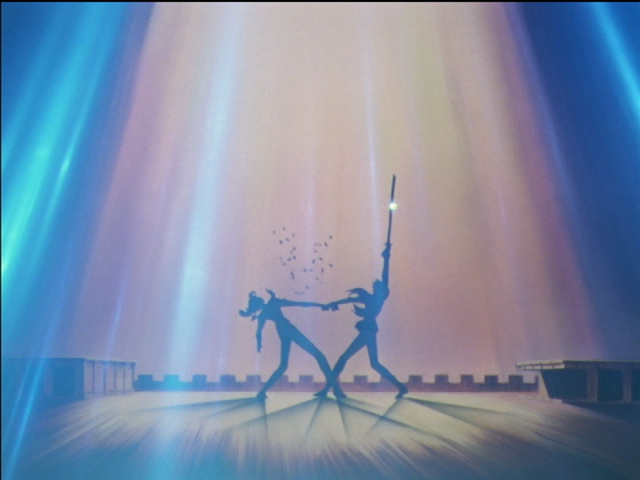 Utena holds Wakaba by the hand, preventing her from falling to the ground when she loses the duel.