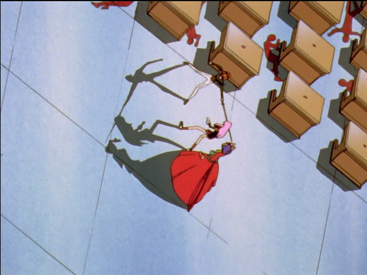 Wakaba strikes with her sword at Utena, with Anthy nearby dodging. They cast silhouette-like shadows.