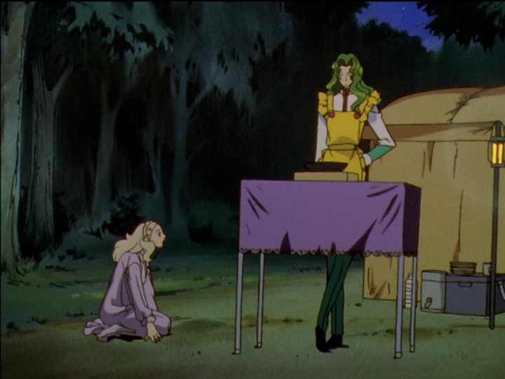 Nanami falls to her knees in front of Saionji, who is cooking eggs.