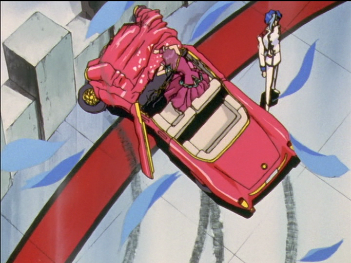 In the duel, Shiori’s car has crashed. Ruka stands and Shiori is down in the car.