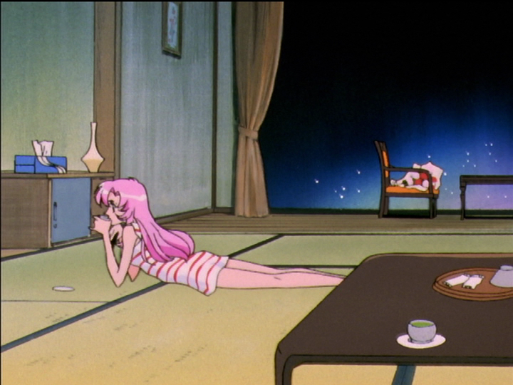 Utena lies on the floor in the hotel room, watching television.