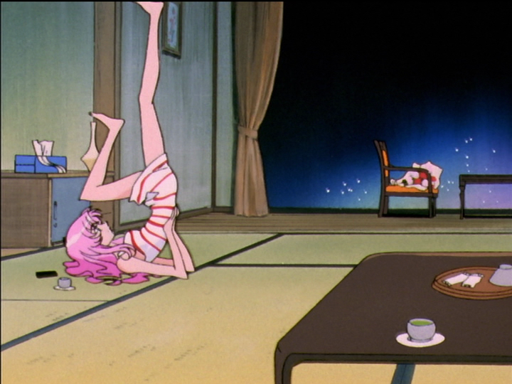 Utena on the floor, bicycling her legs in the air despite her short dress.
