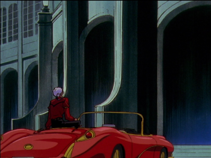 Akio sits on his car while Utena is out of view, lying down inside it.