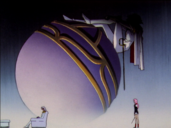 Utena stands on the right. Akio sits on the white sofa, facing away from Utena, on the left. In the background is the huge egg off the world with the effigy of Dios.