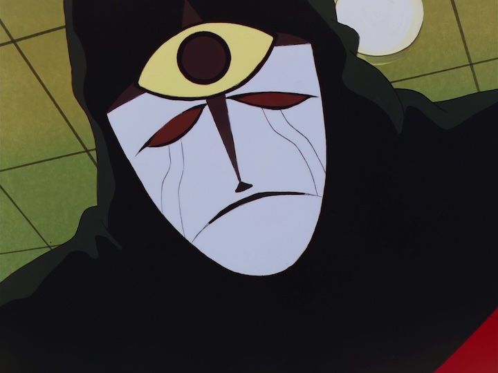 A Neo Atlantean wears a mask with a third eye symbol.