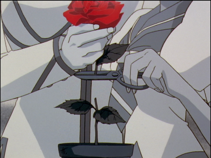 In Nanami’s imagination, Anthy cuts the rose that Touga holds, dropping the rose’s flowerpot on Nanami’s head.