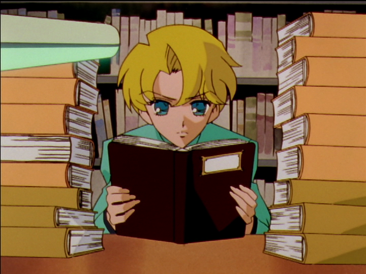Mitsuru in the library, surrounded by tall stacks of books.