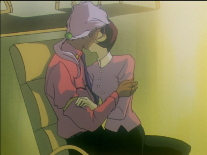 Akio kisses Tokiko, surrounded by the yellow of Mikage’s jealousy.