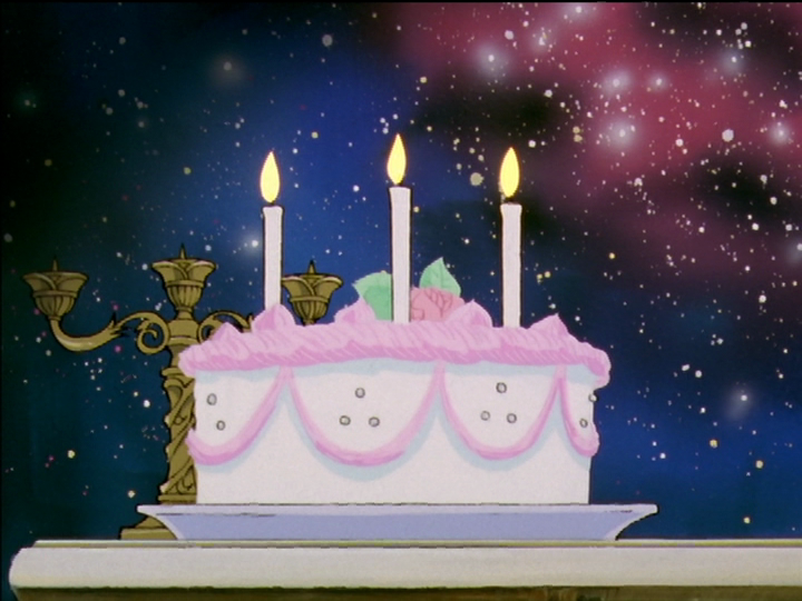 Akio’s cake with the three candles, resembling a birthday cake.