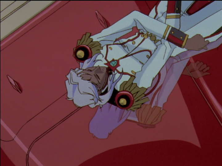 Akio reflected on his shiny car as he lies down on it.
