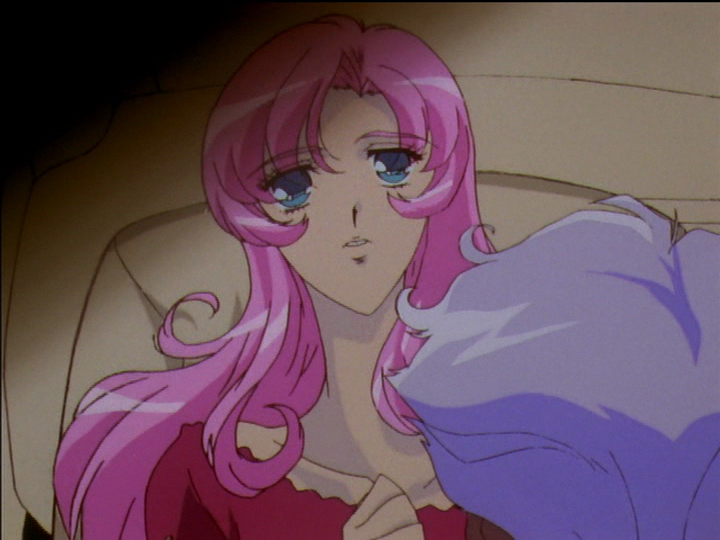 Utena is lying back in Akio’s car as he holds her arms down. She looks worried.