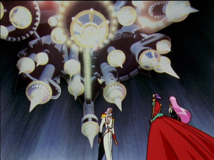 The castle in the sky looms huge over the dueling arena, Akio Anthy and Utena looking small beneath it.