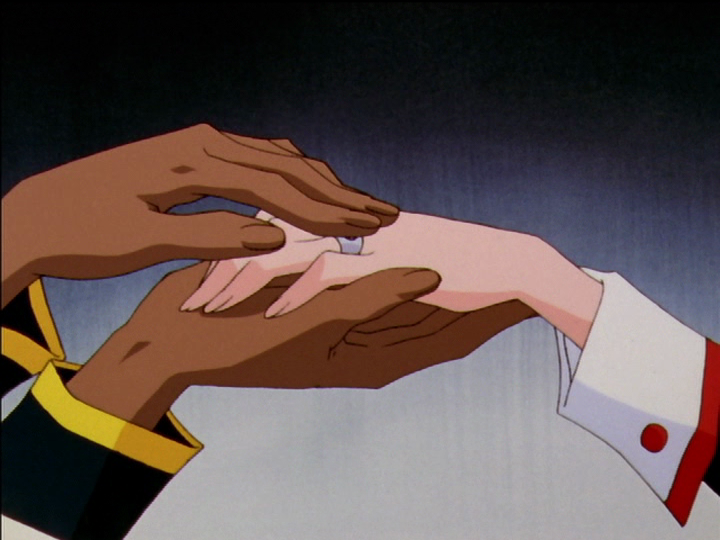 Akio rubs Utena’s ring.