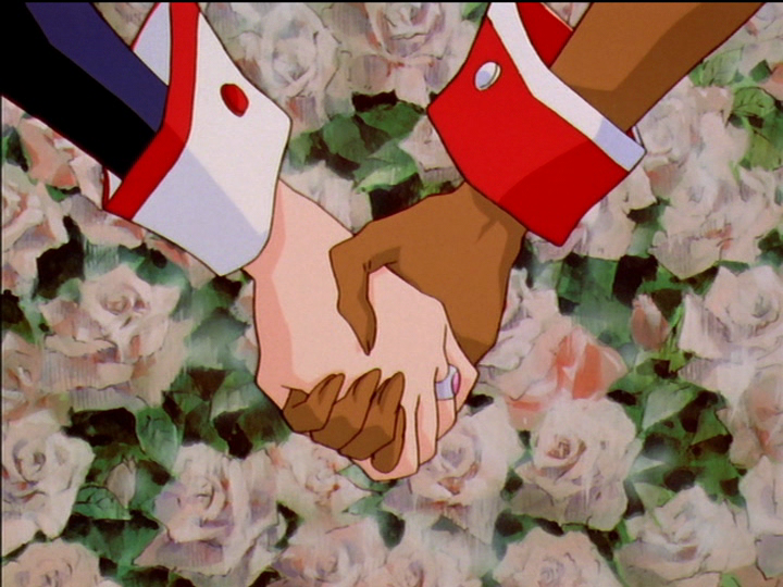 Anthy and Utena hold hands firmly.